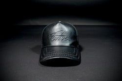 TAJI LEATHER TRUCKER HAT