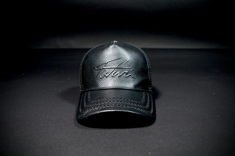 TAJI LEATHER TRUCKER HAT